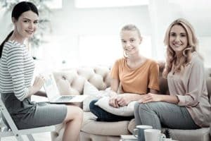 women talking in a family therapy program