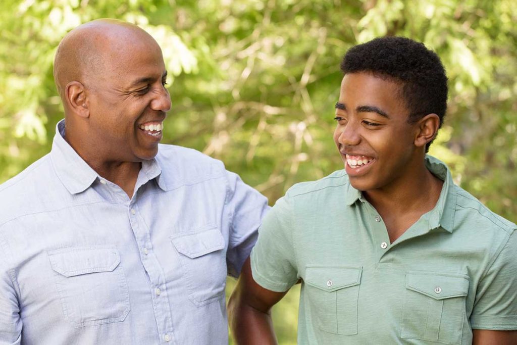 a man and his son talking about mental health disorders in adolescents