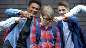 a teen is bullied by his classmates