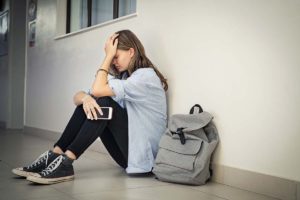 a teen struggles to cope with symptoms of her bipolar disorder in school and needs effective mental health treatment
