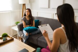 teen and therapist discussing what dialectical behavior therapy helps to treat